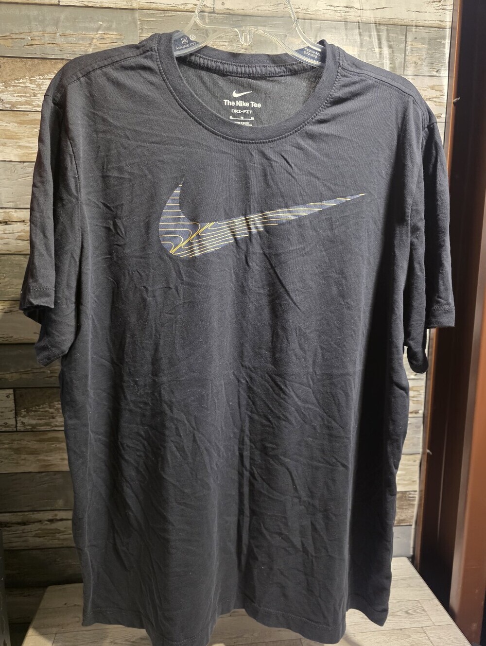 Nike Black Short-Sleeve Logo Tee with Subtle Striped Swoosh